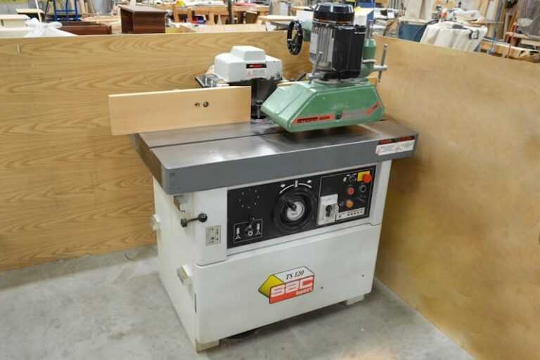 Wood Moulder Buying Guide: Types, Uses, Costs, and Wood Shaper Comparison 25 Industrial woodworking jointer planer machine with green motor and metal table in a workshop